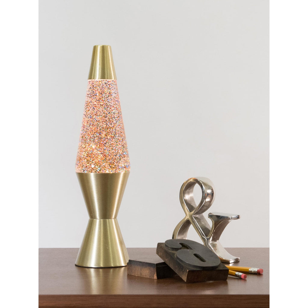 14.5" LAVA� Lamp Rainbow Glitter - Clear/Gold on a table with knick knacks